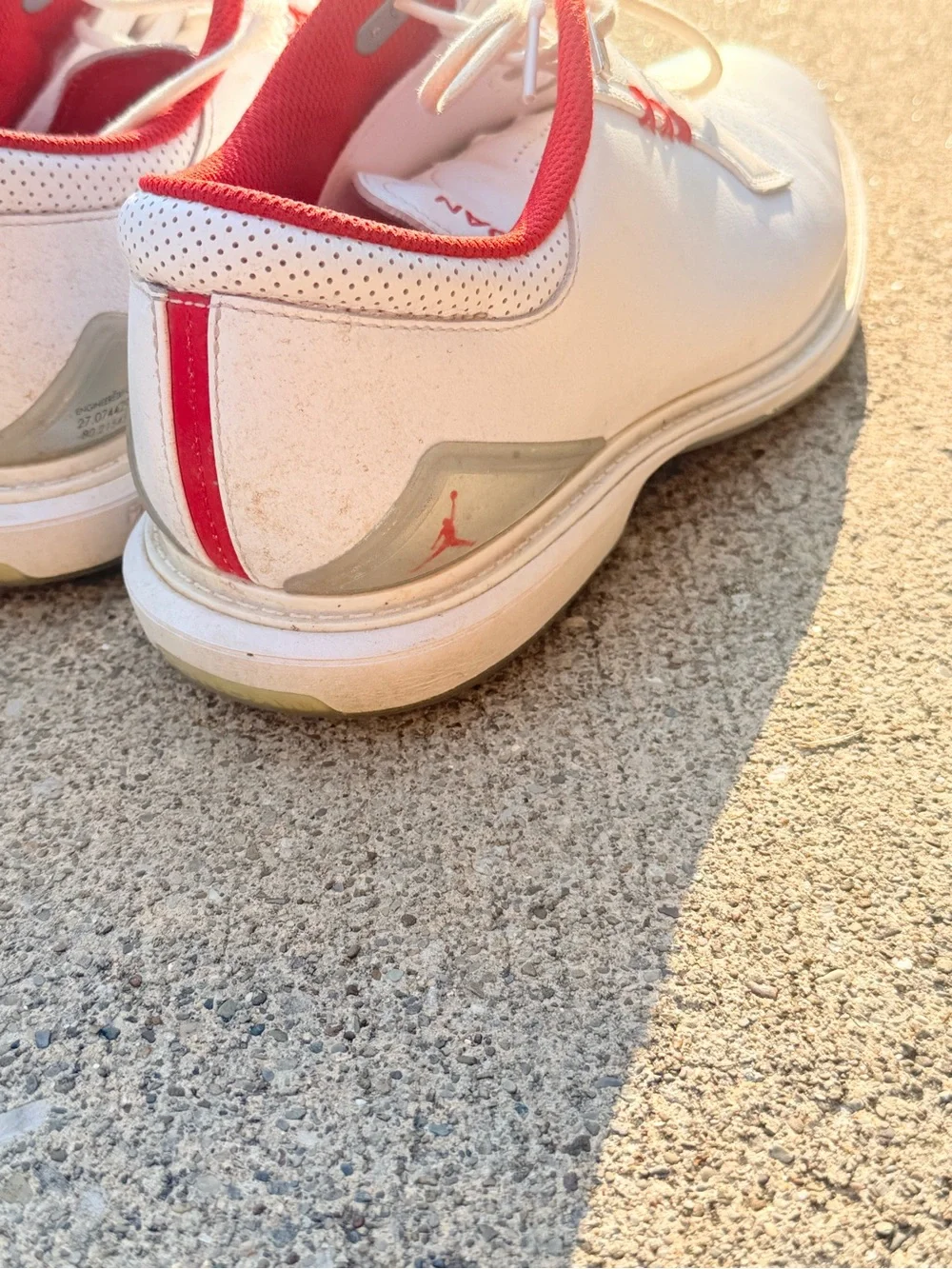 Jordan ADG 5 Golf Shoes in the White/Fire Red/Metallic Silver colorway